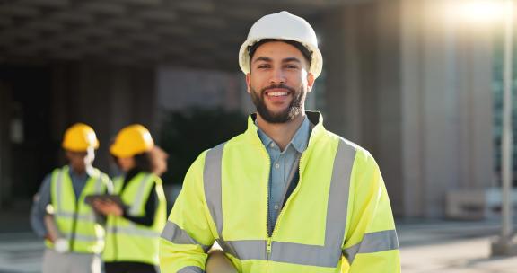 A construction worker smiling