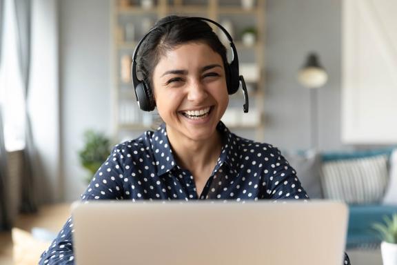 Woman smiling with a headset on